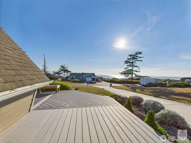 The side deck offers stunning views, making it an ideal spot to unwind and take in the surrounding beauty.