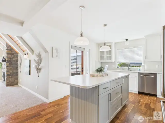 This open-concept kitchen flows seamlessly into the family room, allowing everyone to gather and stay connected whether you're cooking or relaxing.