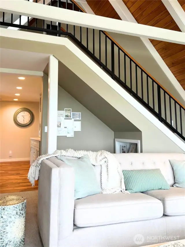 Family Room is open to the custom iron railing that leads you to the upstairs sitting room and 3rd bedroom.