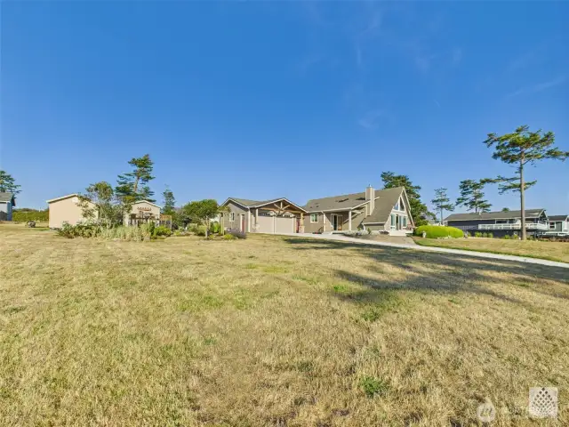 In addition to the ample space, the double lot includes a charming garden area and a custom-built shed that seamlessly connects and enhances the overall layout of the yard.