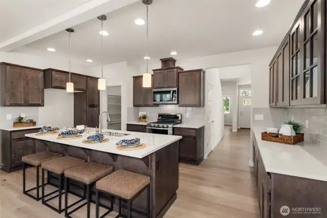 Home is under construction. Photos are of a previously built home from the same community with similar finishes that are staged. Builder reserves the right to change features, plans, prices & specifications without notice. Features vary by plan. Buyer to verify square footage.
