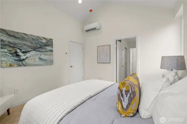 Primary suite with vaulted ceilings