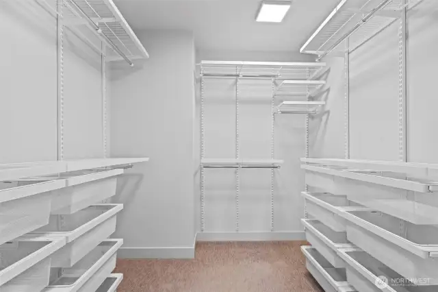Walk-in closet has been upgraded with Elfa closet system featuring adjustable shelves and drawers.