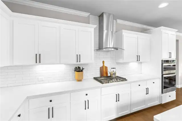 Custom cabinets with under cabinet lighting, soft close feature and upgraded hardware and upgraded quartz countertops