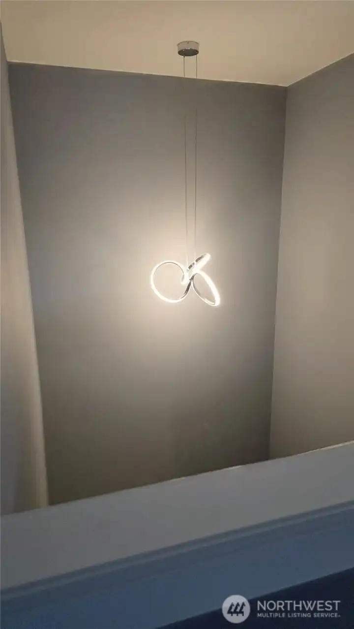 Beautiful pendant light going up the stairs.