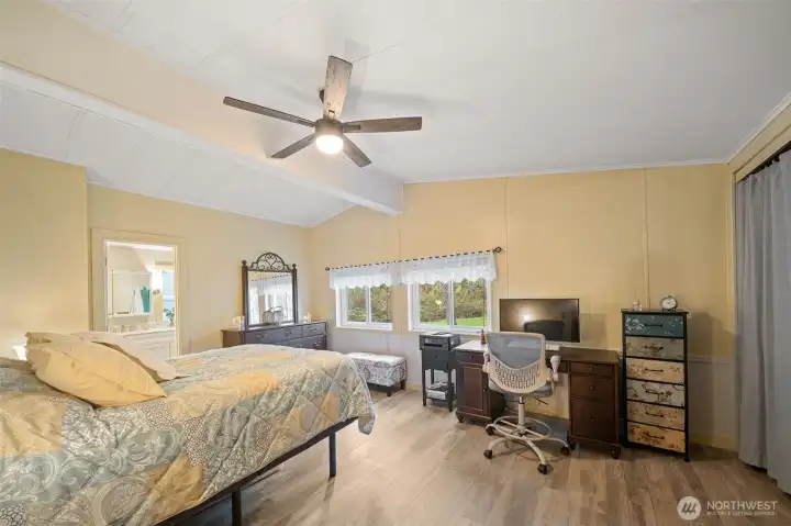 The primary has room for all your furniture and even home office!