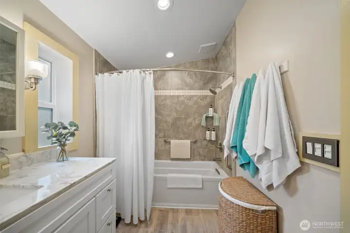 Primary bathroom with updated vanity to include a granite counter top!