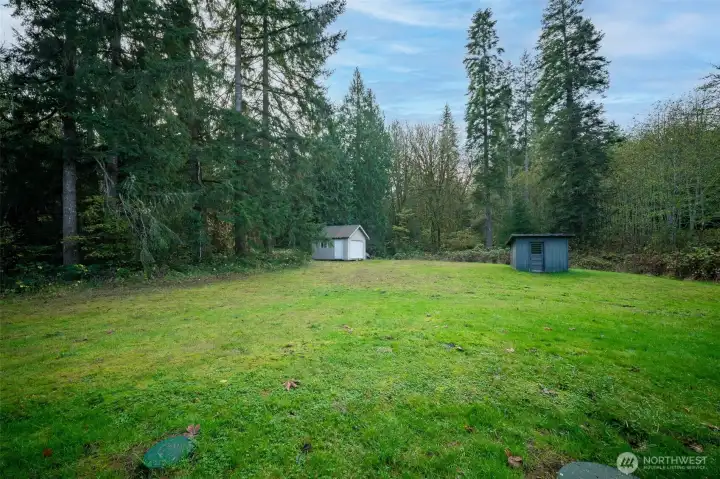 Out back you find the large storage shed and pump house