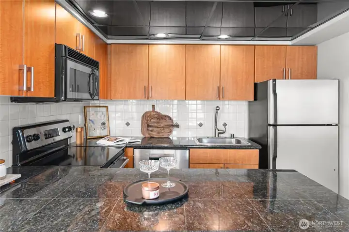 Ample cabinet storage and prep areas.