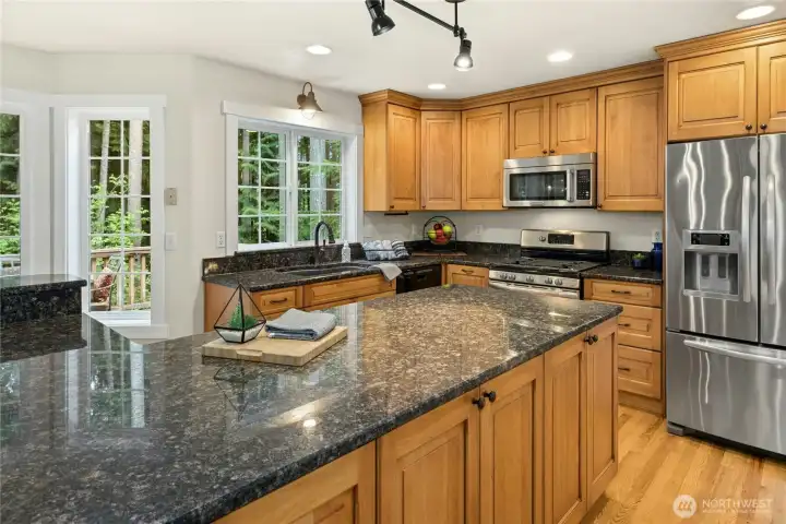 Chef's kitchen with granite countertops and custom cherry cabinets-including space saving pull-outs and organization tools Chef's kitchen with granite countertops and custom cherry cabinets-including space saving pull-outs and organization tools