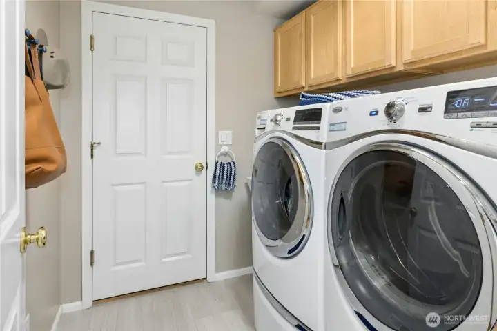 Utility/Laundry room with deep sink, washer dryer, cabinets and a hidden storage closet for all your major cleaning supplies Utility/Laundry room with deep sink, washer dryer, cabinets and a hidden storage closet for all your major cleaning supplies