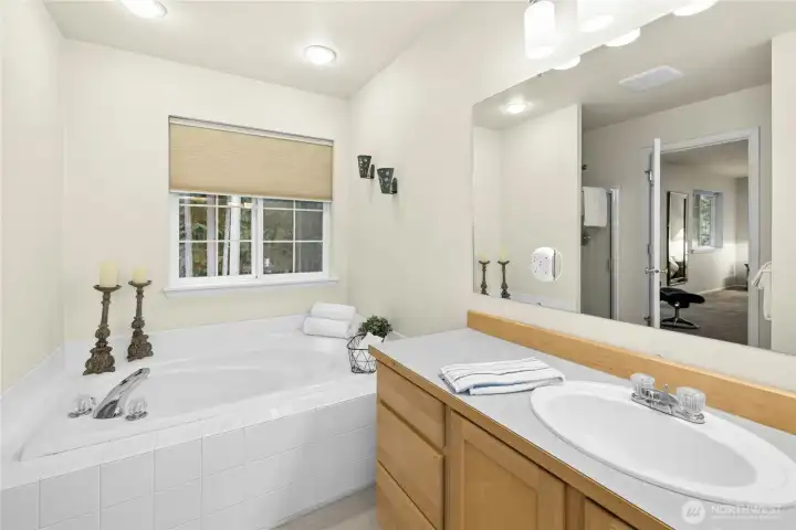 Five piece primary ensuite bathroom with large double sink counters, private water closet with high-rise toilet Five piece primary ensuite bathroom with large double sink counters, private water closet with high-rise toilet