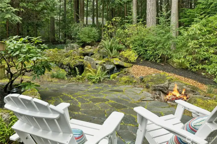 Enjoy fire and water on your slate patio with firepit next to your bubbling waterfall pond Enjoy fire and water on your slate patio with firepit next to your bubbling waterfall pond
