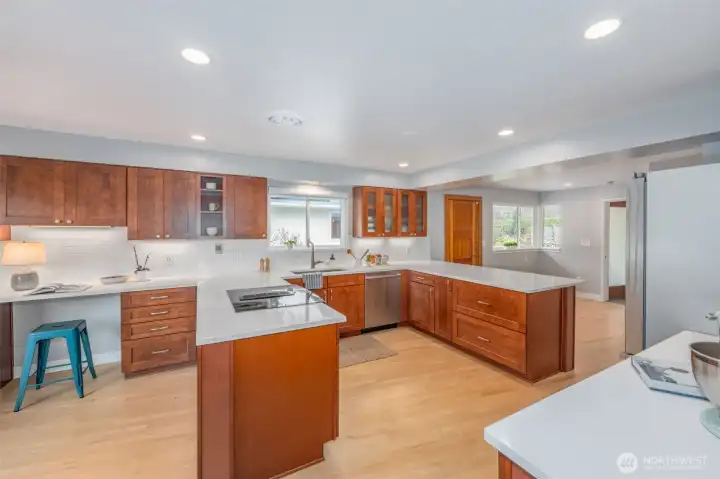 Hosting a party is a breeze with this clever layout. The kitchen was remodeled in 2016, featuring quartz counters, baking station, and what could be a coffee bar area.