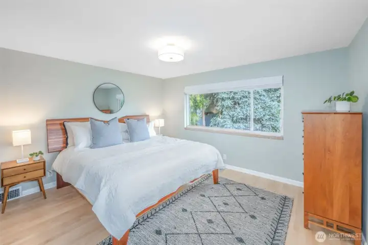 Primary bedroom on main overlooks the front garden. King size bed fits no problem!