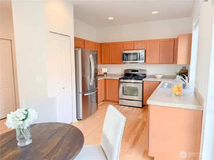 The kitchen boasts lots of storage space, including a pantry