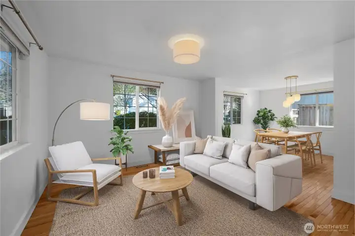 The virtually staged living and dining areas highlight a well-designed floor plan that offers exceptional flexibility and seamless flow for both everyday living and entertaining.