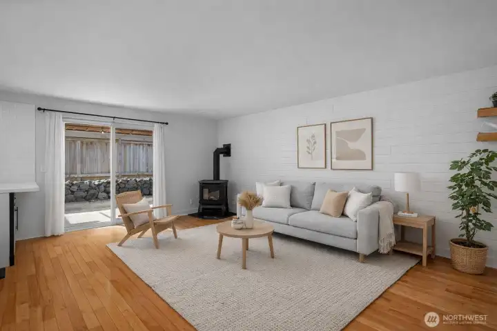 The virtually staged family room offers the perfect place to unwind at day’s end or enjoy relaxed weekend downtime. Freestanding gas stove adds warmth and ambiance.