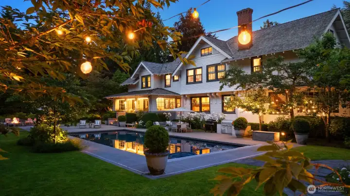 Fairy lights twinkle at sunset creating a magical backdrop for entertaining or quiet evenings at home.