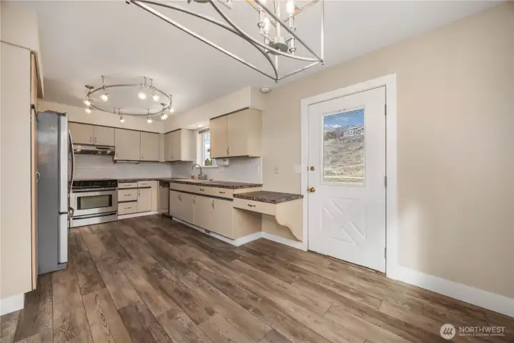 Kitchen, Dining & Door to Deck.