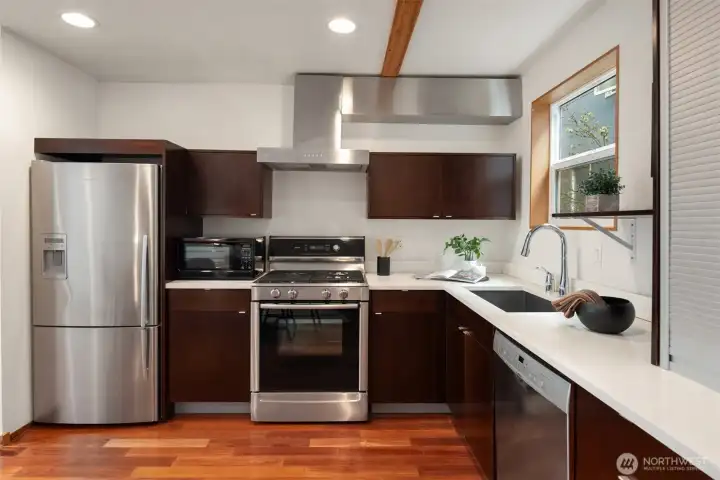 All appliances stay (gas range w/ range hood that vents to the exterior)
