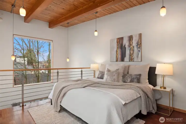 Spaces can be flexible. This could be an office, and downstairs could be used as your primary. Both can fit a Queen/King bed.