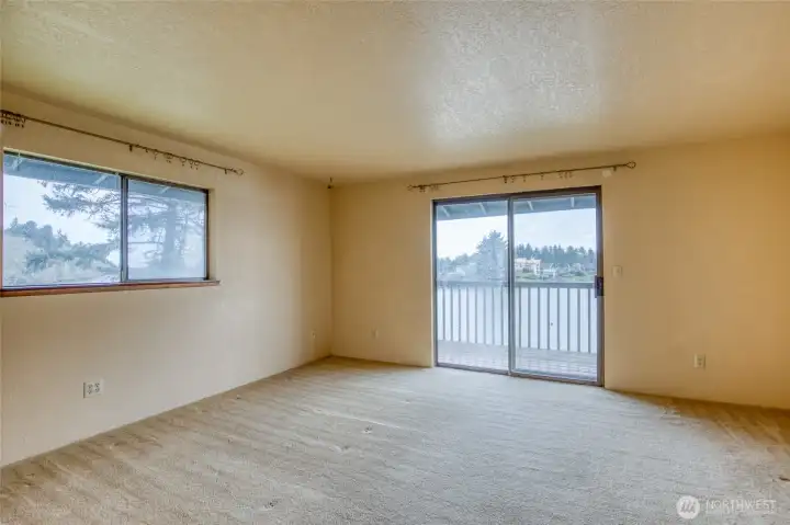 The primary bedroom has sliding doors to the deck where you have a full view of Duck Lake! The primary bedroom has sliding doors to the deck where you have a full view of Duck Lake!