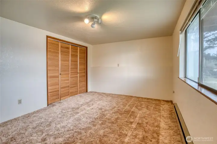 The spacious bedroom features a large storage closet for visitors! The spacious bedroom features a large storage closet for visitors!