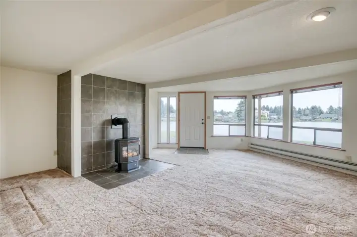 The lower level also has a family room with a free-standing propane stove! Go out the doorway and down to your own dock! The lower level also has a family room with a free-standing propane stove! Go out the doorway and down to your own dock!