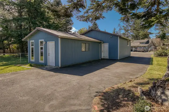 The property also offers a seperate shop at the entrance to the double lot with an additional two-car garage! The property also offers a seperate shop at the entrance to the double lot with an additional two-car garage!