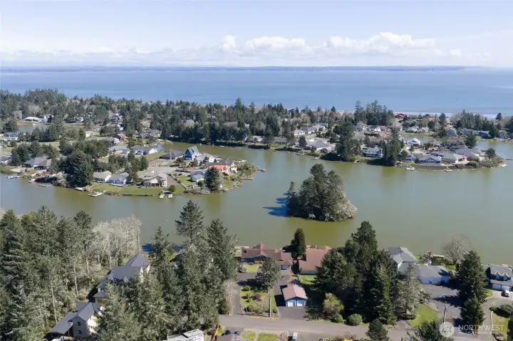 Drone view from the property showing homes, lake and then beyond is the Bay! Drone view from the property showing homes, lake and then beyond is the Bay!
