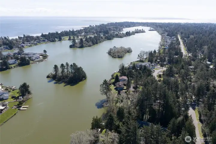 Drone view over head of the home showing more of the lake with 23 miles of waterways and the river to the south! Drone view over head of the home showing more of the lake with 23 miles of waterways and the river to the south!