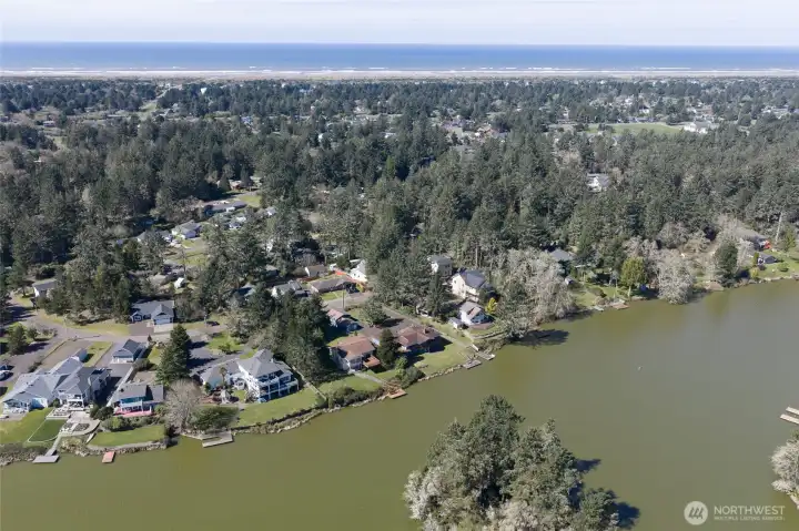 Drone view showing the home, lake and the Pacific Ocean in the background! Drone view showing the home, lake and the Pacific Ocean in the background!