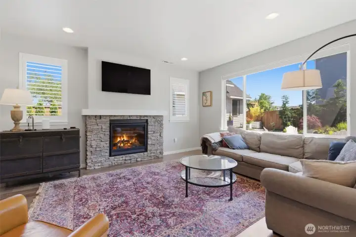 Living room with gas fireplace and mantle