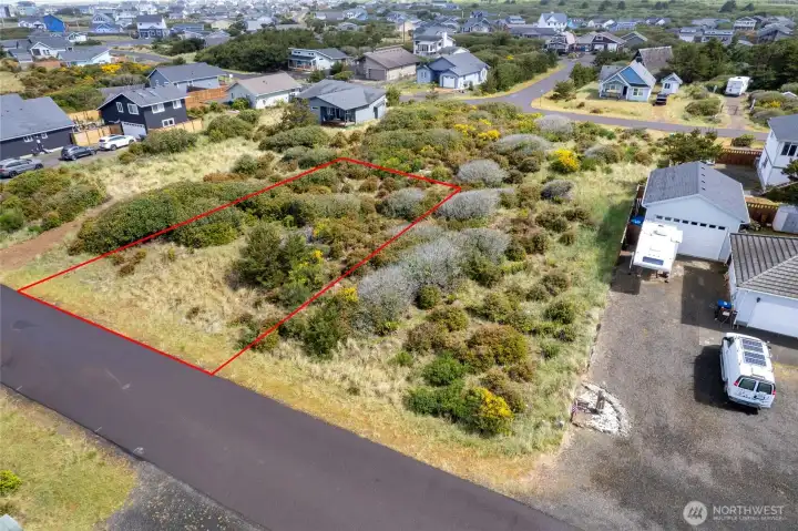 Positioned on approximately 0.17 acres, this spacious lot combines flexibility, location, and natural beauty.