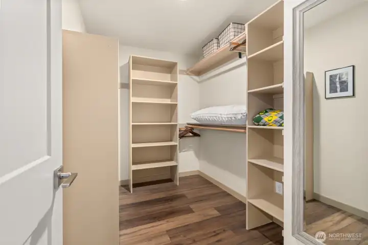 Primary bedroom walk-in closet Primary bedroom walk-in closet