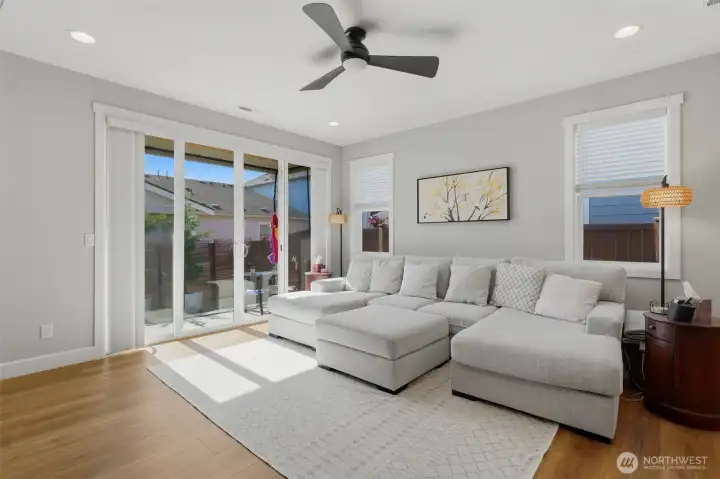 Bright, open, and effortless. See how beautifully the living space connects to the fully fenced, low-maintenance backyard for true Pacific Northwest living.