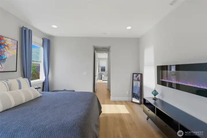 Cozy winter nights are covered! Love the added touch of the electric fireplace in this spacious primary bedroom.