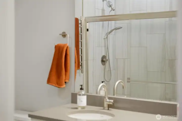 Pristine and move-in ready. This beautifully maintained full bath ensures your family and guests always have their own stylish, comfortable space.