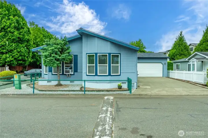2 Car attached garage with extra long driveway. Low maintenance landscape
