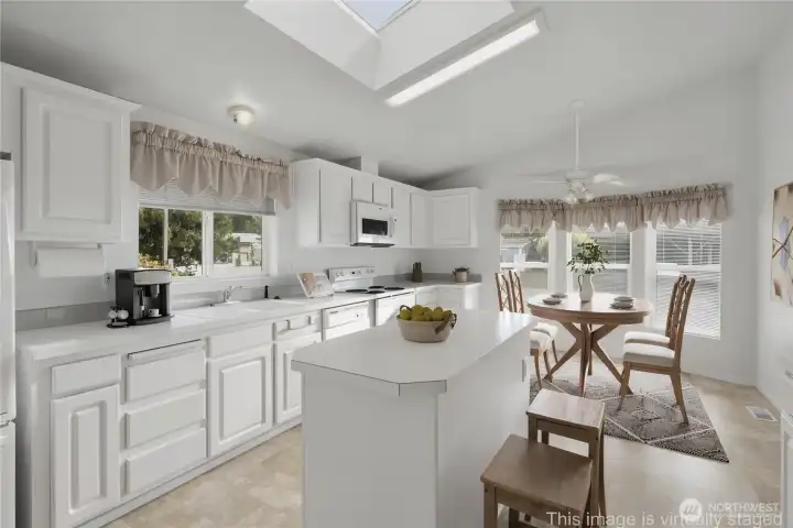 Light and bright kitchen with skylights, tons of cabinets and counter space.  All appliances stay