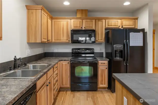 The kitchen provides ample storage for a well-stocked kitchen.