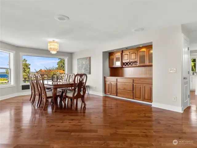 Formal dining room with built in hutch, amazing views and hardwood floors.