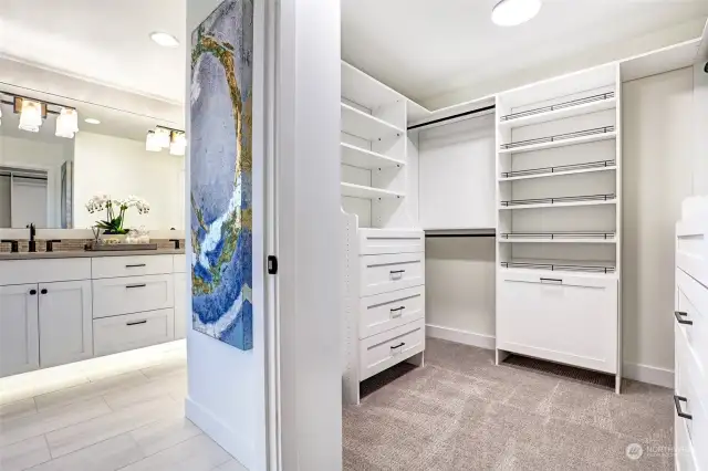 Primary walk in closet is built out with custom build outs as are all closets in the home!