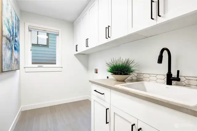 Upstairs laundry room includes a washer and dryer (not shown here but currently in the home)! There is also a second location on the lower level off the garage for a second washer and dryer!