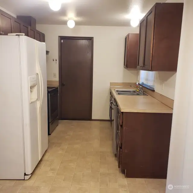 Kitchen Area. Access to Garage