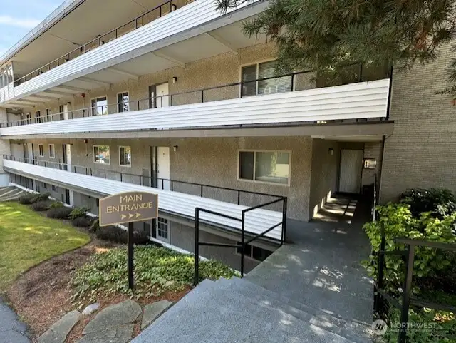 #203 is an end unit just 3 steps down from the main driveway & close to the main entrance.