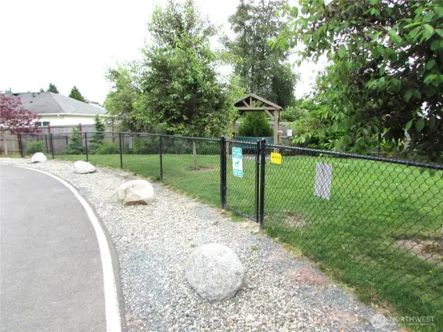 COMMUNITY MEMBERS ENJOY THIS NEW ENCLOSED DOG PARK, JUST STEPS AWAY.
