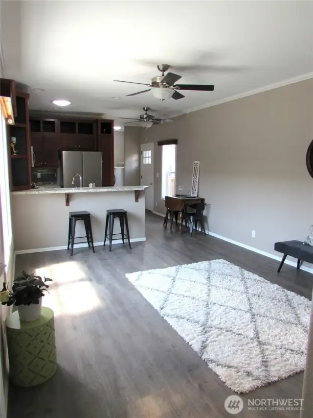 SPACIOUS LIVING ROOM AREA, 10 FT. HIGH CEILING AND HEAT PUMP TO KEEP YOU COMFORTABLE IN ALL SEASONS.