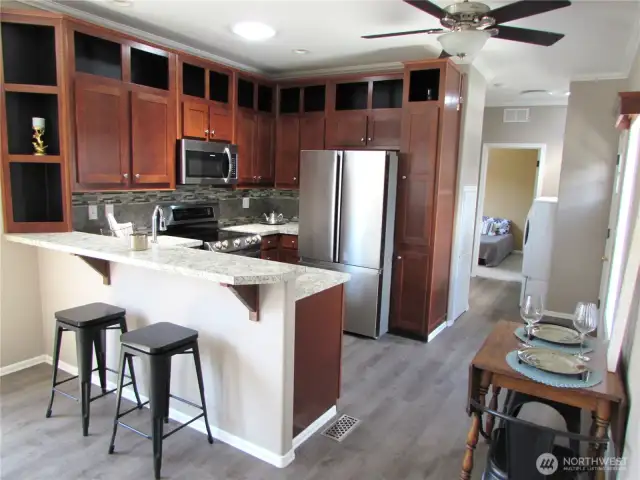 KITCHEN HAS PLENTY OF STORAGE AND ALL S.S. APPLIANCES STAY.
